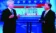 A picture of two men on a television news broadcast