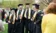 A picture of five male graduates