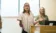 A woman talks to a classroom