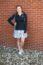 A picture of a women in a Dordt Business Club Jacket
