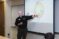 Professor Zevenbergen points to a graph on the projector screen in accounting class