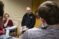 Professor Volkers discusses a book with his digital media class