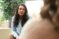 Professor Mouw listens intently as she sits and talks with someone