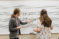Faculty member and student work out music notes on a whiteboard