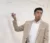 Male instructor pointing at whiteboard with marker