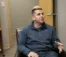 A picture of Alex Vasquez sitting in a chair