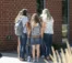 A picture of student standing in a circle outside of the Commons