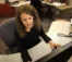 A picture of a women working on a computer