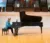 Female student plays Steinway piano on stage