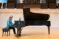 Female student plays Steinway piano on stage