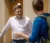 Male guest speaker listens to student after class