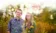 A picture of two students in a grassy area