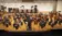 A picture of a symphony performing on stage