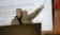 Dr. Kari Sandouka pointing to a presentation slide