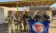 A picture of soldiers standing in a line holding a flag and their guns