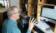 A picture of a man in a radio broadcasting booth