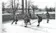 A group of students play ice hockey