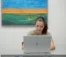 A woman works on her laptop