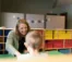 A teacher works one on one with a student