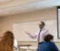 A picture of a professor teaching a class