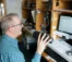 A picture of a man in a radio broadcasting booth