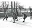 A group of students play ice hockey