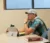 Male student sits at desk with a surface pro in actuarial science class