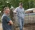 Dr. Olthoff and a student stand beside a sheep pen