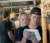 Two students read the measurements on a device
