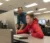 Male student working with faculty member at a computer