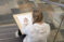 Girl sitting on stairs drawing