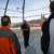 Students receive a tour of a juvenile detention center yard