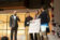 Students receive an award at a film challenge on campus