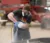 A student sprays chemical on a hydro dipping project