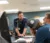 Professor speaks with students in a lab