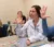 Students in class raise hands at desks