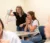 Two girls look at a creation of pipe cleaners as they do the brain game in class