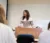 Professor Mouw stands at the lectern at the front of class