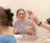 a female student smiles as a class plays the brain game
