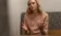 Dr. Tara Boer talks to someone using her hands to gesture