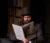 Actor with top hat reads A Christmas Carol