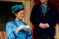 male and female student dressed in costumes act out a scene in a play
