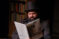 Actor with top hat reads A Christmas Carol