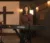 Female student sits at keyboard and sings in recording studio