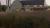 A picture of Dordt's Campus Center behind some prairie grass
