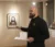 Art professor discussing art in the gallery