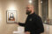 Art professor discussing art in the gallery