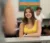 Female student sitting at desk engaged in conversation