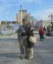 A couple takes a picture in a city