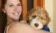 A picture of a female student holding a dog